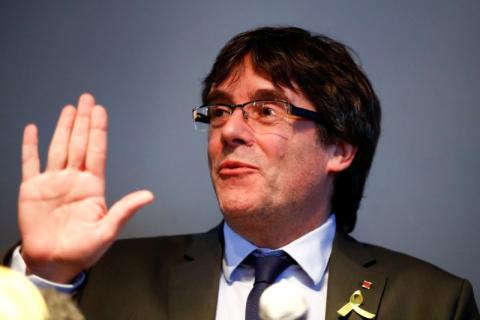 Catalonia's former leader Carles Puigdemont gestures during a news conference in Berlin, Germany, April 7, 2018. PHOTO BY REUTERS/Hannibal Hanschke