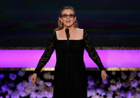 Actress Carrie Fisher introduces her mother, actress Debbie Reynolds, as the recipient of the Life Achievement Award at the 21st annual Screen Actors Guild Awards in Los Angeles, California January 25, 2015. PHOTO BY REUTERS/Mario Anzuoni