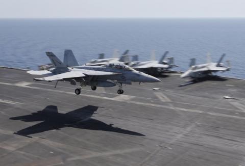 A F/A-18E/F Super Hornets of Strike Fighter Attack Squadron 211 (VFA-211) lands on the flight deck of the USS Theodore Roosevelt (CVN-71) aircraft carrier in the Gulf June 18, 2015. PHOTO BY REUTERS/Hamad I Mohammed