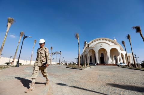 A member of Egyptian Army walks outside the new Coptic Cathedral "The Nativity of Christ" before Sunday's Coptic Christmas Eve Mass in the New Administrative Capital (NAC) east of Cairo, Egypt, January 3, 2019. PHOTO BY REUTERS/Amr Abdallah Dalsh