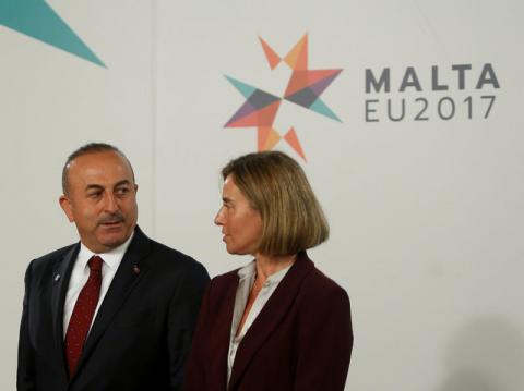 Turkey's Foreign Minister Mevlut Cavusoglu (L) talks with High Representative of the European Union for Foreign Affairs, Federica Mogherini, before a meeting with European Union Foreign Ministers in Valletta, Malta, April 28, 2017. PHOTO BY REUTERS/Darrin Zammit Lupi
