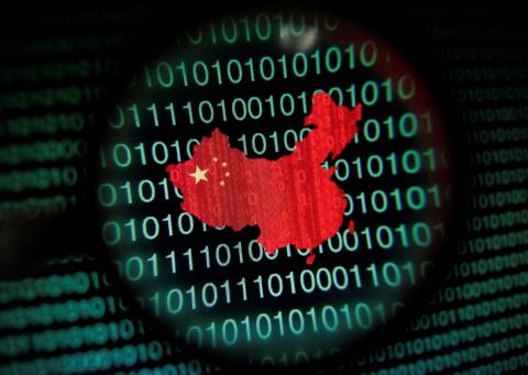 A map of China is seen through a magnifying glass on a computer screen showing binary digits in this January 2, 2014 photo illustration. PHOTO BY REUTERS/Edgar Su/Illustration