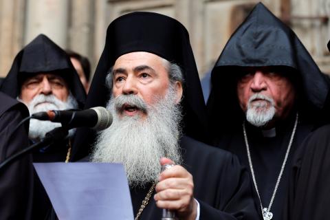 Greek Orthodox Patriarch of Jerusalem, Theophilos III, speaks during a news conference with other church leaders in front of the closed doors of the Church of the Holy Sepulchre in Jerusalem's Old City, February 25, 2018. PHOTO BY REUTERS/Amir Cohen