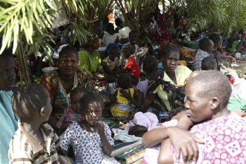 Civilians rest inside the United Nations compound on the outskirts of the capital Juba in South Sudan