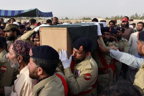 Army soldiers carry the casket of Siraj Raisani, provincial assembly candidate of Baluchistan Awami Party (BAP), who was killed in Friday's suicide attack during an election campaign meeting, for the funeral in Quetta, Pakistan, July 14, 2018. PHOTO BY REUTERS/Naseer Ahmed