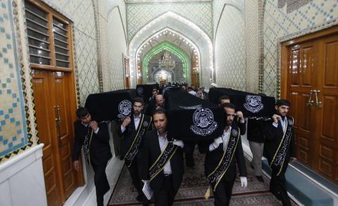 Mourners carry the coffins of victims killed by a bomb attack at a Shi'ite Muslim village near the Iraqi city of Baquba, during a funeral at the Imam Ali shrine in Najaf, 160 km (100 miles) south of Baghdad