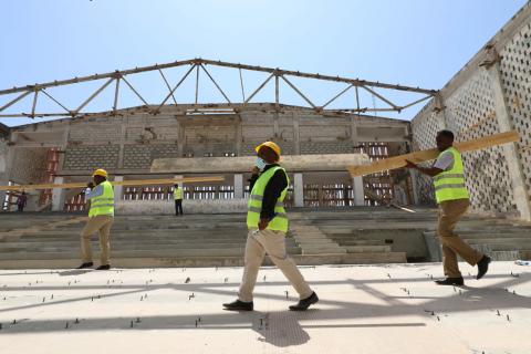 Construction workers carry wooden beams as they take part in the renovation project of Somalia's National Theatre in Mogadishu, Somalia, February 3, 2019. PHOTO BY REUTERS/Feisal Omar