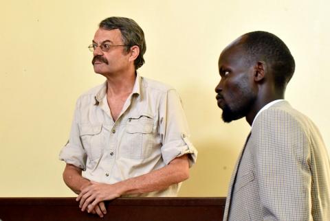 William John Endley, a South African national and an adviser to South Sudanese rebel leader Riek Machar, stands in the dock, as his Lawyer Gar Adel Gar looks on, in the High Court in Juba, South Sudan, February 13, 2018. PHOTO BY REUTERS/Samir Bol