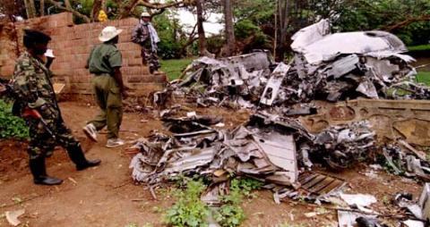 Rwanda Patriotic Front (R.P.F.) rebels inspect the wreckage of the plane in which Rwandan President Juvenal Habyarimana was killed, May 26, 1994. The plane crashed April 6, 1994. PHOTO BY REUTERS/Corinne Dufka