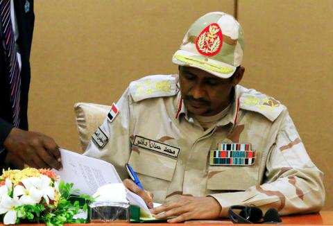 Deputy Head of Sudanese Transitional Military Council, Mohamed Hamdan Dagalo signs a constitutional declaration in Khartoum, Sudan, August 4, 2019. PHOTO BY REUTERS/Mohamed Nureldin Abdallah