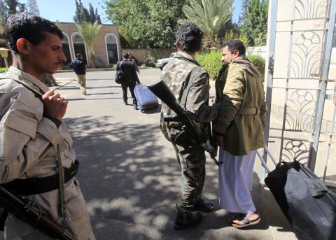 A relative of a Houthi delegation member participating in the negotiations in Sweden carries a bag at Sanaa airport, Yemen, December 4, 2018. PHOTO BY REUTERS/Mohamed al-Sayaghi