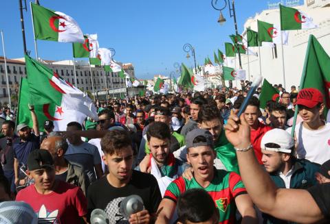 Demonstrators shout slogans and carry national flags during a protest against the country's ruling elite, on the anniversary of the 1954 revolution against French colonial rule, in Algiers, Algeria. PHOTO BY REUTERS/Ramzi Boudina