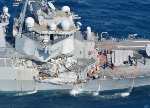 The Arleigh Burke-class guided-missile destroyer USS Fitzgerald, damaged by colliding with a Philippine-flagged merchant vessel, is seen off Shimoda, Japan in this photo taken by Kyodo, June 17, 2017. PHOTO BY REUTERS/Kyodo