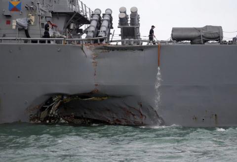 The U.S. Navy guided-missile destroyer USS John S. McCain is seen after a collision, in Singapore waters, August 21, 2017. PHOTO BY REUTERS/Ahmad Masood