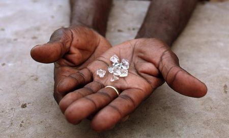An illegal diamond dealer from Zimbabwe displays diamonds for sale in Manica, near the border with Zimbabwe, September 19, 2010. PHOTO BY REUTERS/Goran Tomasevic