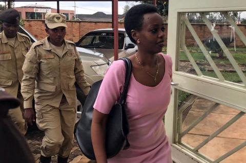 Diane Shima Rwigara, a prominent critic of Rwanda's president Paul Kagame, is escorted by police officers into a courtroom in Kigali, Rwanda, November 7, 2017. PHOTO BY REUTERS/Jean Bizimana