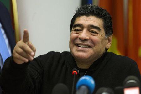 Former Argentine soccer player Diego Maradona reacts during a news conference at the European Parliament office in Rome, February 14, 2014. PHOTO BY REUTERS/Giampiero Sposito