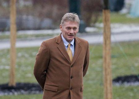 Dmitry Peskov at the Tomb of the Unknown Soldier by the Kremlin walls in central Moscow, February 23, 2014. PHOTO BY REUTERS/Maxim Shemetov