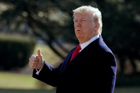 U.S. President Donald Trump gestures as he walks on South Lawn of the White House in Washington, U.S., before his departure to the Customs and Border Protection National Targeting Center, February 2, 2018. PHOTO BY REUTERS/Yuri Gripas