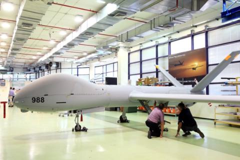Employees check an Elbit Systems Ltd. Hermes 900 unmanned aerial vehicle (UAV) at the company's drone factory in Rehovot, Israel, June 28, 2018. PHOTO BY REUTERS/Orel Cohen