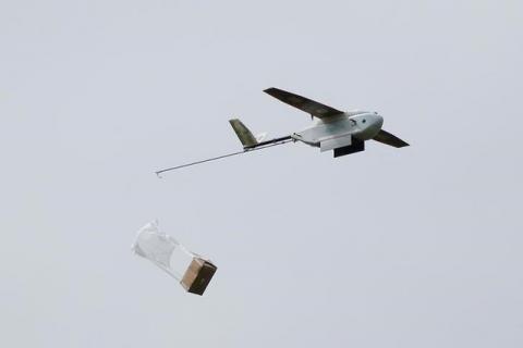 A Zipline delivery drone releases its payload midair during a flight demonstration at an undisclosed location in the San Francisco Bay Area, California, U.S., May 5, 2016. PHOTO BY REUTERS/Stephen Lam