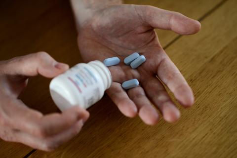 Will Nutland, who supports a drug-buying network and takes generic drugs himself to prevent HIV infection, shows off some of his generic drugs during an interview with Reuters at his home in central London, Britain, November 3, 2016. PHOTO BY REUTERS/Dylan Martinez