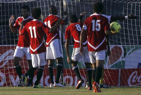 Egypt's Mohamed Aboutrika (L) celebrates with teammates after scoring a goal against Guinea during their 2014 World Cup qualifying soccer match