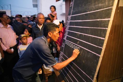 An electoral official tallies the ballots casted on a black board after the presidential election at a polling centre in Ambohidratrimo, Antananarivo, Madagascar, November 7, 2018. PHOTO BY REUTERS/Malin Palm