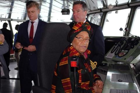 Liberian President Ellen Johnson-Sirleaf sits aboard a ship carrying emergency health supplies provided by the Netherlands to aid in the fight against the Ebola virus at the port of Liberia in Monrovia, November 24, 2014. PHOTO BY REUTERS/James Giahyue