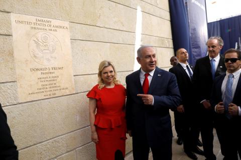 Israeli Prime Minister Benjamin Netanyahu and his wife Sara Netanyahu stand next to the dedication plaque of the U.S. embassy in Jerusalem, after the dedication ceremony of the new U.S. embassy in Jerusalem, May 14, 2018. PHOTO BY REUTERS/Ronen Zvulun