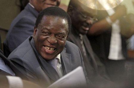 Zimbabwe Vice-President Emmerson Mnangagwa listens as President Robert Mugabe delivers his state of the nation address to the country's parliament in Harare, August 25, 2015. PHOTO BY REUTERS/Philimon 