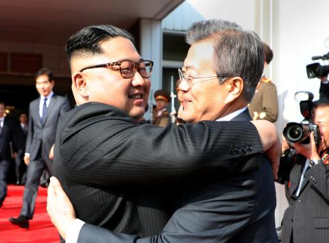 South Korean President Moon Jae-in bids farewell to North Korean leader Kim Jong Un as he leaves after their summit at the truce village of Panmunjom, North Korea, in this handout picture provided by the Presidential Blue House on May 26, 2018. PHOTO BY REUTERS/The Presidential Blue House 