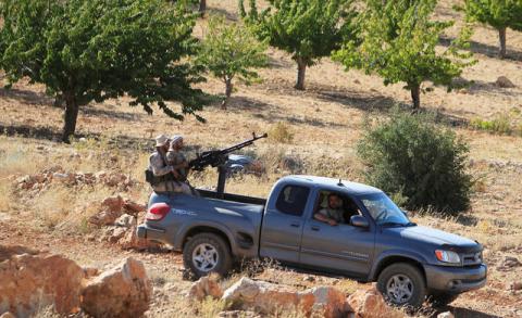 Hezbollah fighters are seen in a truck in Jroud Arsal, near Syria-Lebanon border, August 13, 2017. PHOTO BY REUTERS/Ali Hashisho