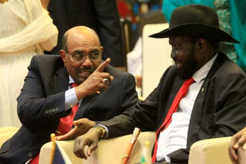 South Sudan's President Salva Kiir (R) talks to Sudan's President Omar Hassan al-Bashir after signing a ceasefire and power-sharing agreement with South Sudanese rebel leader Riek Machar in Khartoum, Sudan, August 5, 2018. PHOTO BY REUTERS/Mohamed Nureldin Abdallah