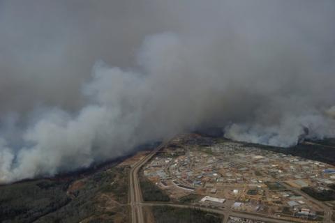 A Canadian Joint Operations Command aerial photo shows wildfires near neighborhoods in Fort McMurray, Alberta, Canada in this image posted on twitter, May 5, 2016. PHOTO BY REUTERS/Courtesy CF Operations