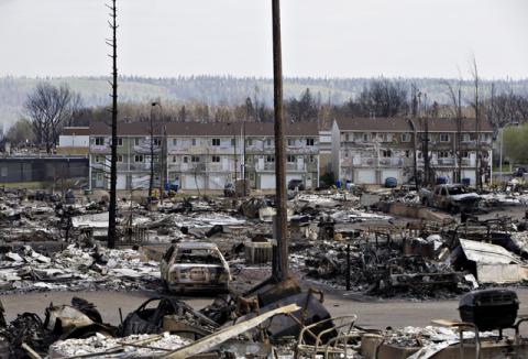 The devastated neighbourhood of Abasand is shown after being ravaged by a wildfire in Fort McMurray, Alberta, Canada, May 13, 2016. PHOTO BY REUTERS/Jason Franson