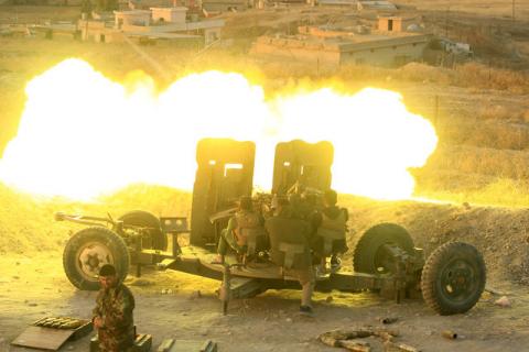 Peshmerga forces fire an anti-aircraft gun towards Islamic state militants positions in the town of Naweran near Mosul, Iraq, October 20, 2016. PHOTO BY REUTERS/Zohra Bensemra