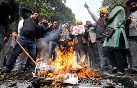 People burn placards and effigies of India's main opposition Congress party's leaders Sajjan Kumar and Kamal Nath during a protest near Congress party's headquarters in New Delhi, India, December 17, 2018. PHOTO BY REUTERS/Anushree Fadnavis