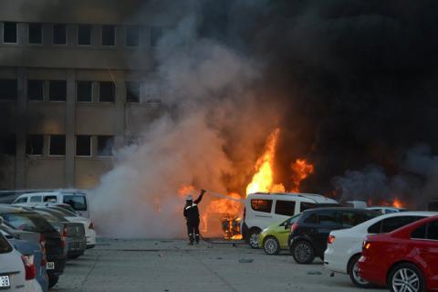 A firefighter tries to extinguish burning vehicles after an explosion outside the governor's office in the southern city of Adana, Turkey, November 24, 2016. PHOTO BY REUTERS/Ihlas News Agency