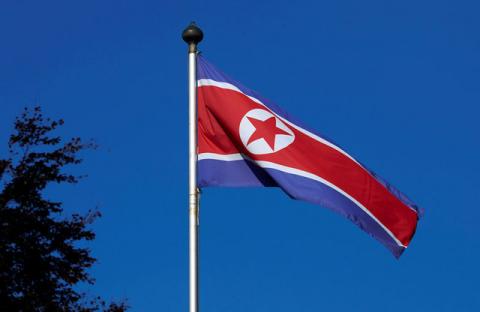 A North Korean flag flies on a mast at the Permanent Mission of North Korea in Geneva, October 2, 2014. PHOTO BY REUTERS/Denis Balibouse