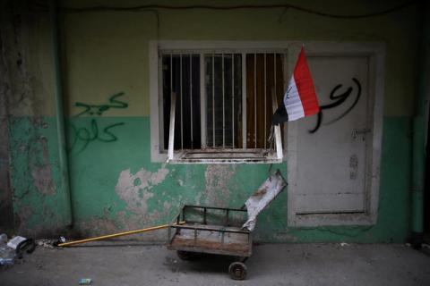 A flag of Iraq is seen outside a house on a street controlled by Iraqi Federal Police in western Mosul, Iraq, April 12, 2017. PHOTO BY REUTERS/Andres Martinez Casares