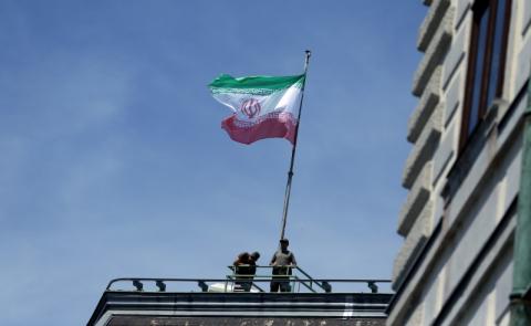 The national flag of Iran is seen on top of the Austrian Chancellery during the visit of President Hassan Rouhani in Vienna, Austria July 4, 2018. PHOTO BY REUTERS/Lisi Niesner