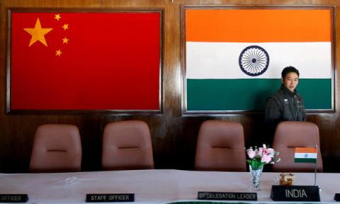 A man walks inside a conference room used for meetings between military commanders of China and India, at the Indian side of the Indo-China border at Bumla, in the northeastern Indian state of Arunachal Pradesh, November 11, 2009. PHOTO BY REUTERS/Adnan Abidi