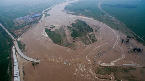 An aerial view shows that roads and fields are flooded in Xingtai, Hebei Province, China, July 21, 2016. PHOTO BY REUTERS/Stringer
