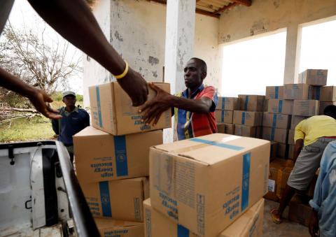 Aid workers load food onto a truck in the aftermath of Cyclone Kenneth on Ibo island north of Pemba, Mozambique, May 1, 2019. PHOTO BY REUTERS/Mike Hutchings