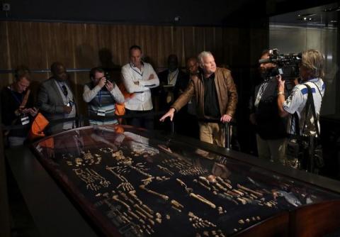 Professor Lee Berger (2nd R) gestures during an exhibit of the largest collection of fossils of close human relatives ever to go on public display in South Africa, at an area named "The Cradle of Humankind," northwest of Johannesburg, South Africa, May 25, 2017. PHOTO BY REUTERS/Siphiwe Sibeko