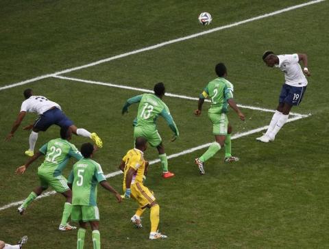 France's Paul Pogba (19) heads to score a goal against Nigeria during their 2014 World Cup round of 16 game at the Brasilia national stadium in Brasilia, June 30, 2014. PHOTO BY REUTERS/David Gray