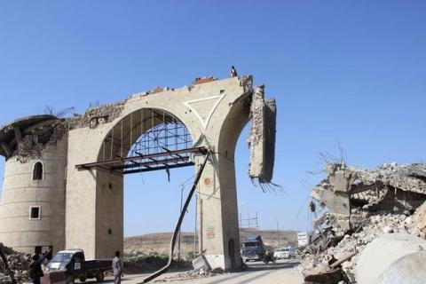 People look at the gate of the northwestern city of Saada, Yemen after a Saudi-led air strike destroyed it, August 23, 2016. PHOTO BY REUTERS/Naif Rahma