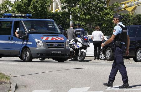 A French Gendarme blocks the access road to the Saint-Quentin-Fallavier industrial area, near Lyon, France, June 26, 2015. PHOTO BY REUTERS/Emmanuel Foudrot