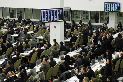 Diplomats watch electronic monitors showing a vote count, as the U.N. General Assembly voted and approved a draft resolution on the territorial integrity of the Ukraine at the U.N. headquarters in New York